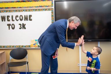 Mayor Bill de Blasio welcomes a 3K for All student at P.S. 377 in Ozone Park on Sept. 5
