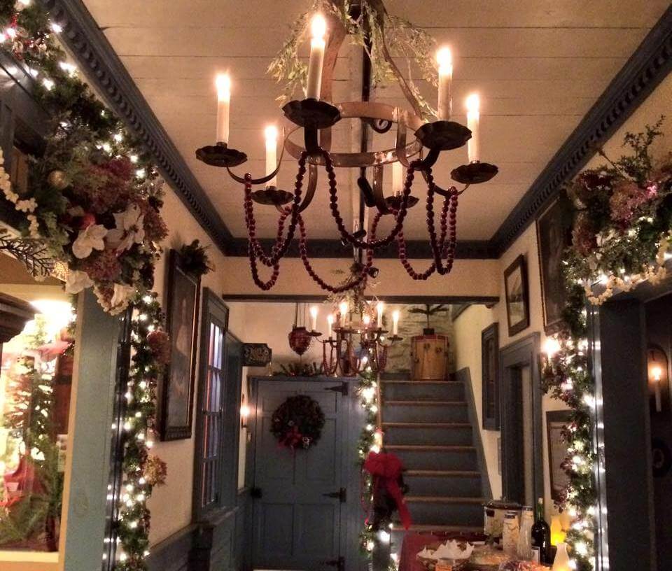 The brightly decorated interior of the Onderdonk House during the holiday season