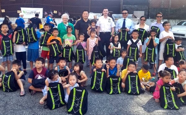 Kim and community leaders host 2018 Backpack Giveaway