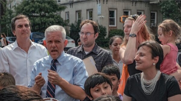 Electeds celebrate new traffic signal installed near PS 343 in Sunnyside