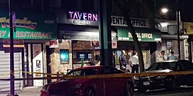 Police investigate a shooting outside the Tavern Lounge in Woodhaven on Oct. 7.