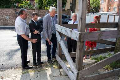 Senator Joseph Addabbo, Assemblyman Brian Barnwell, Councilman Robert Holden, Comptroller Scott Stringer and local resident Nancy Demino look at damage from a sewer project on 74th Street in Middle Village on Sept. 4.