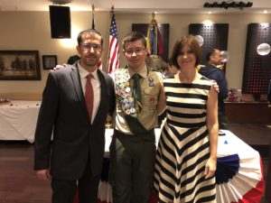 Antonatos (c.) with his parents at the Eagle Court of Honor held at Mythos Restaurant in Flushing.