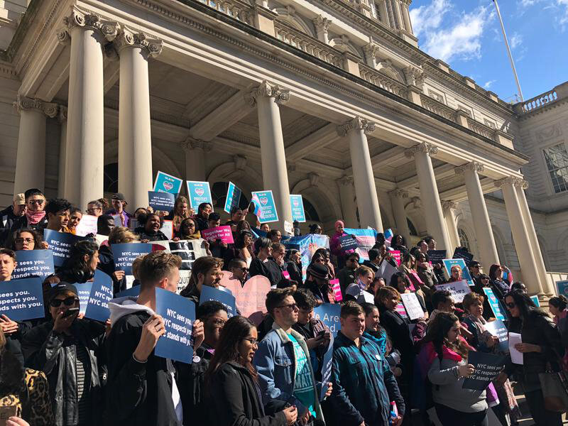 Several hundred rally at City Hall calling out the Trump administration for its attack of the transgender community
