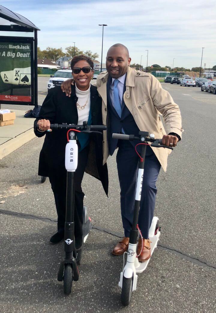 Council Members Adrienne Adams and Donovan Richards test out e-scooters