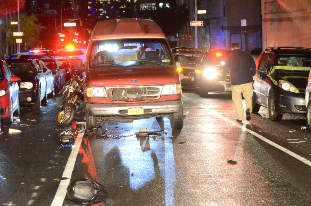 Two people died after a motorcycle and a van collided in Long Island City on Nov. 10.