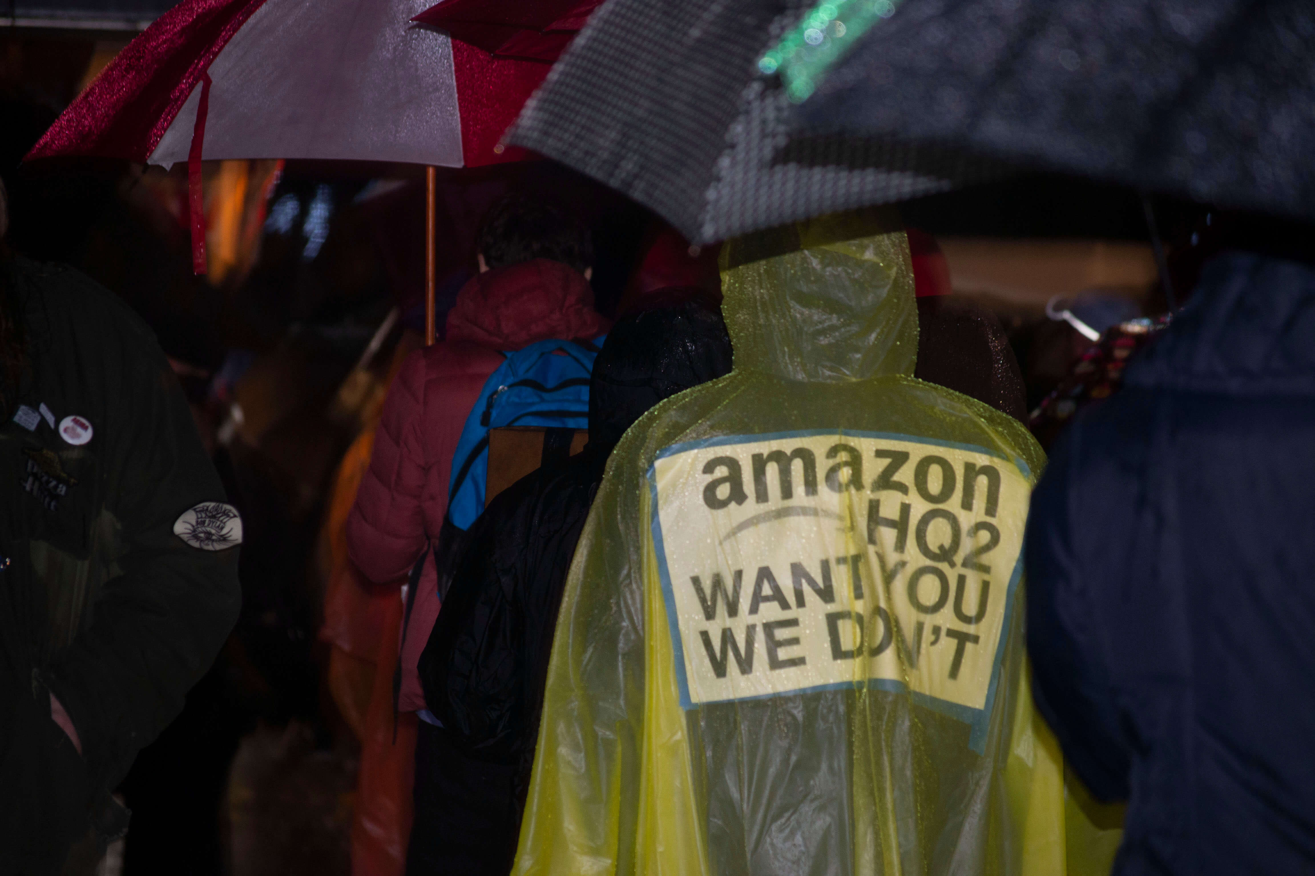 Anti-Amazon protestors stood out in the rain to call for a renegotiation of the City's deal with Amazon in Long Island City.