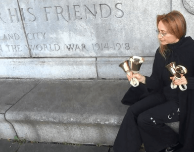 Natalia Paruz plays Taps on two sets of bells to ring in the Armistice Centennial
