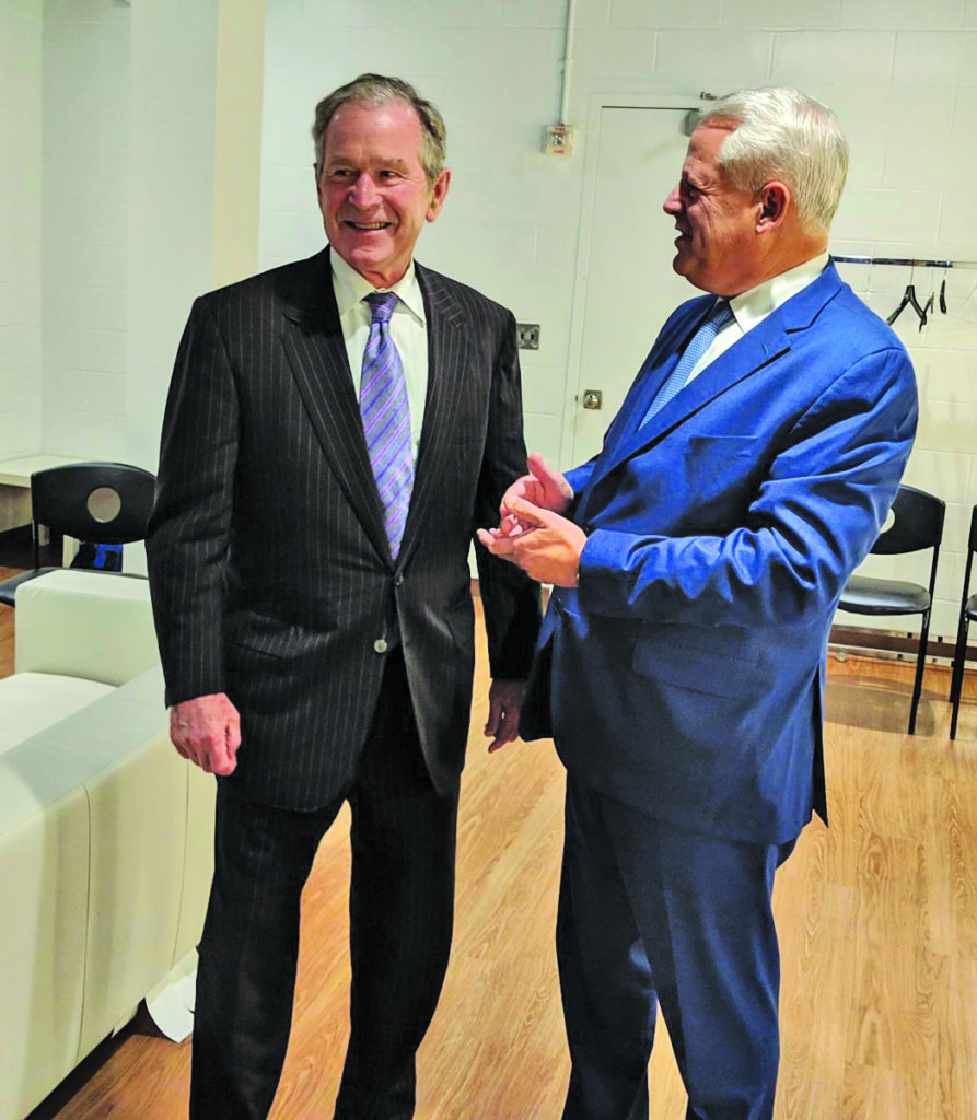 Former President George W. Bush chats with former Congressman Steve Israel