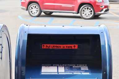 The Rochdale Village post office leaves a notice showing residents how to use the new mail slots.