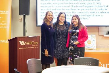 Jessica Chacha (r.) was honored by WellCare of New York for her work with Together We Can Community Resource Center, which serves immigrant families in Jackson Heights, Corona and Elmhurst.