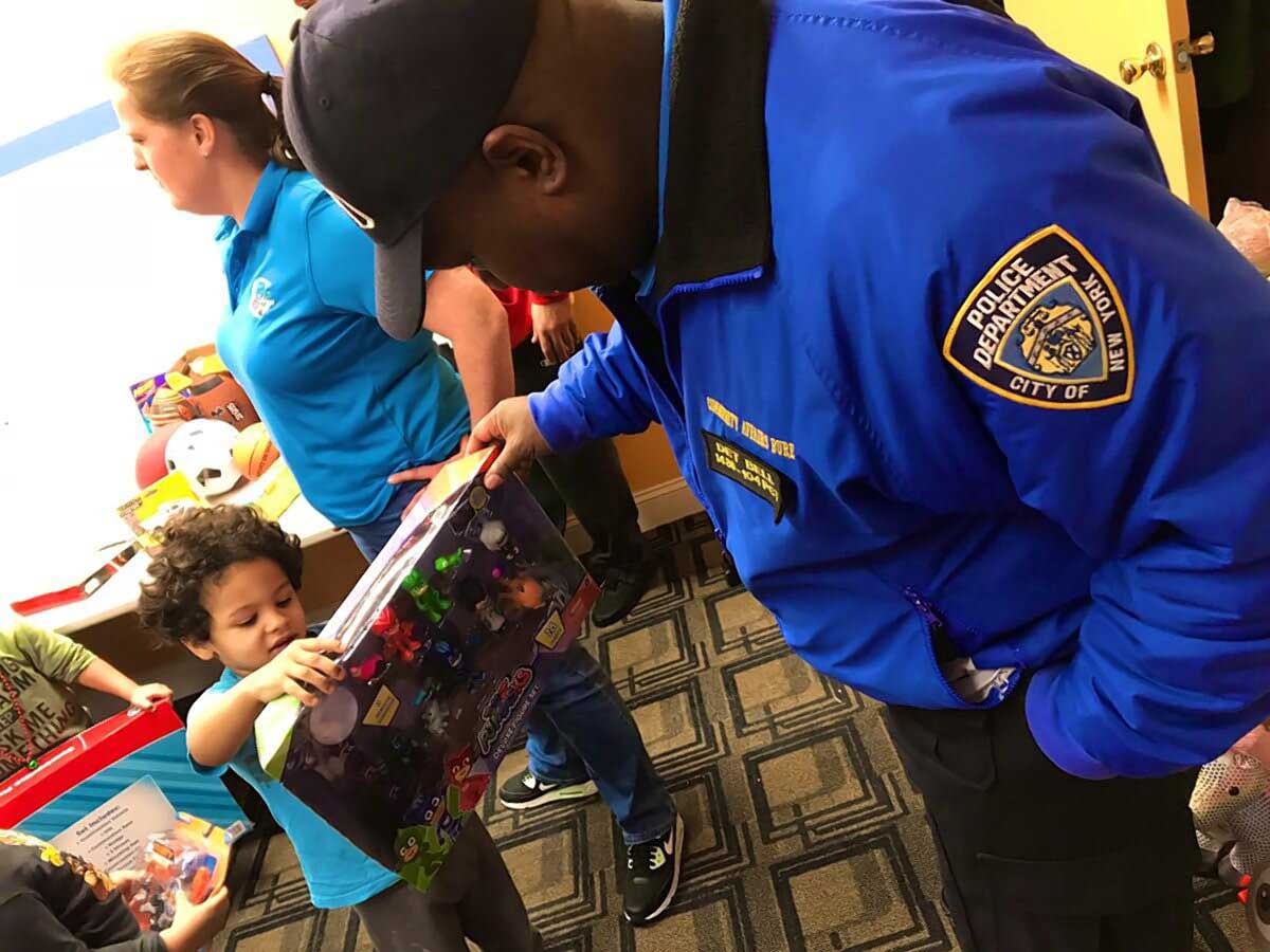 Ridgewood-based 104th Precinct spreads holiday cheer with toy giveaway