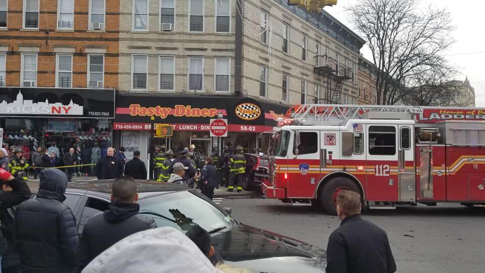 Fire Department units and onlookers at the scene of a crash at the Tasty Diner in Ridgewood on Dec. 9.