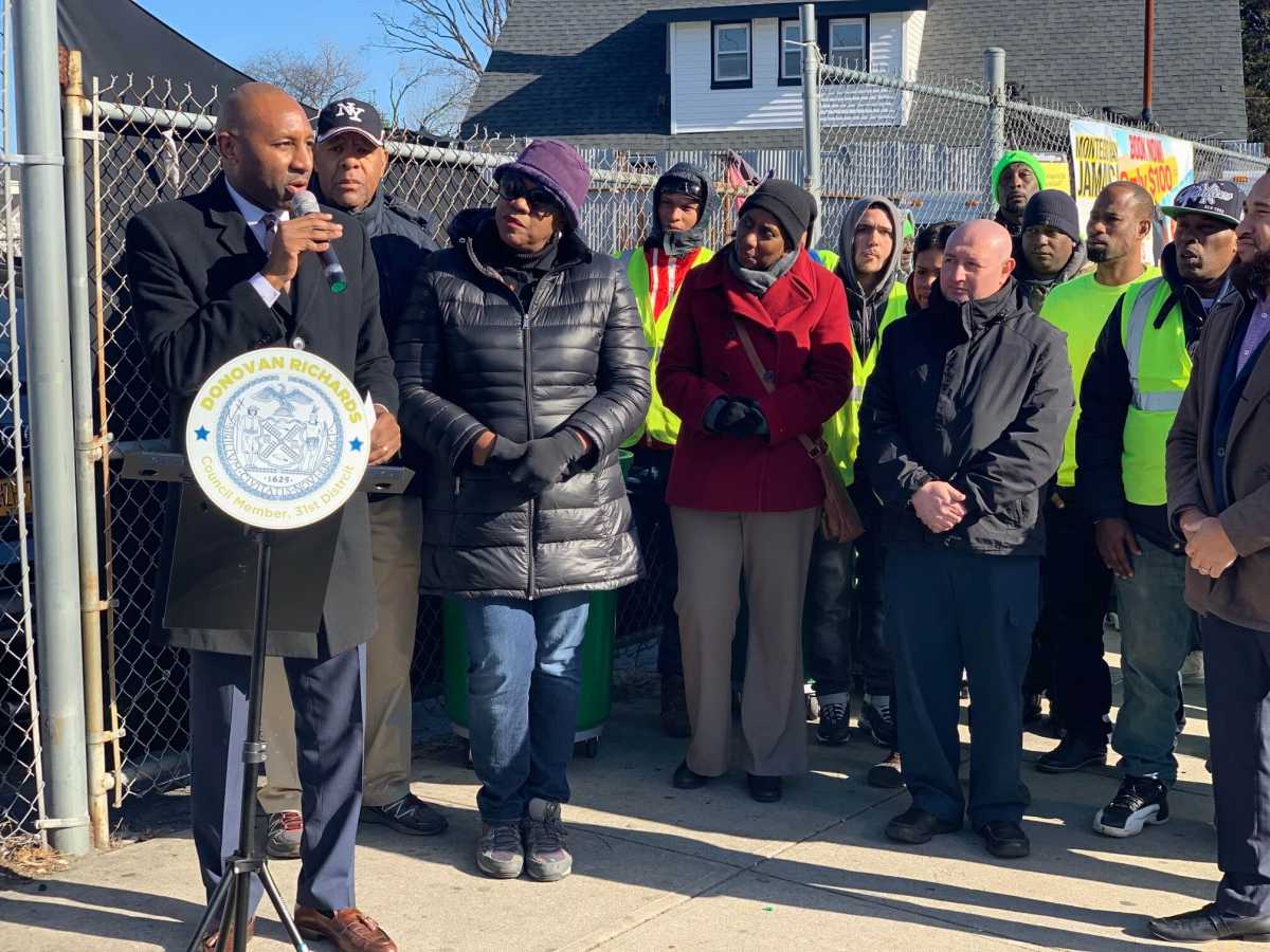 Councilman Donovan Richards (l) allocated $220,000 to clean up his district.