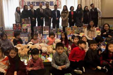 Flushing BID greets children at second annual 2018 Toy Drive