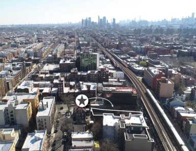 The development site at 25-79 31st St. in Astoria is signified with the star and arrow in the above photo.