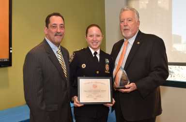 Deputy Inspector Courtney Nilan (c.) commanding officer of the NYPD 102 Precinct.