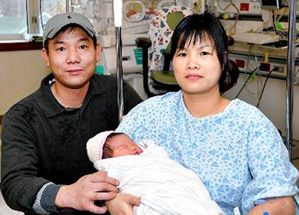 Surprised parents rush to name city's first baby of 2010