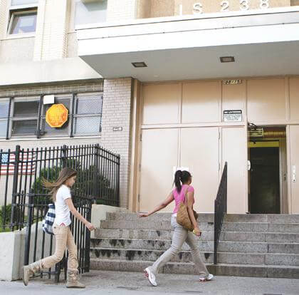 Somber return for IS 238 kids