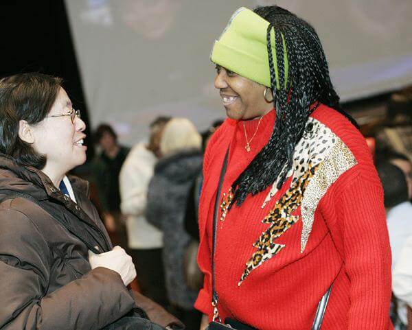 Diverse crowd celebrates Obama at theater in Flushing Town Hall
