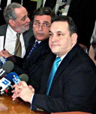 Monserrate fights removal with suit