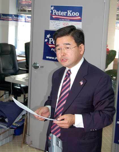 Peter Koo speaks to reporters after being put back on the ballot in his bid to unseat state Sen. Toby Stavisky. Koo called for Stavisky to apologize for what he called a "dirty political trick." Photo by Stephen Stirling