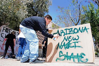 Queens blasts Arizona law
