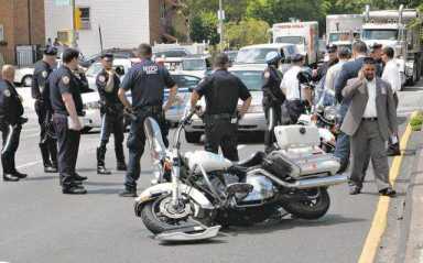 Cops in veep escort injured in collision