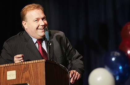 Firm sues Halloran for $12k