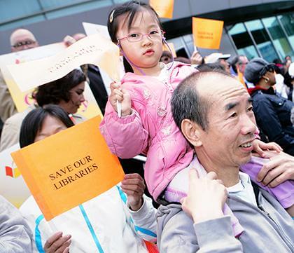 Library supporters rally in Flushing against cuts