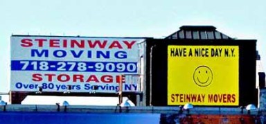 LIC’s Steinway Moving all smiles putting up new sign