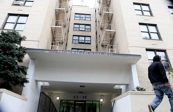 Broadway building settles suit over race