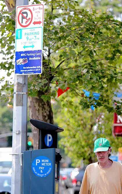 Baysiders hail removal of street cleaning signs from Bell Blvd.