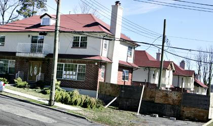 Baysiders slam empty houses built by Huang