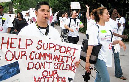 Queens Community House rallies against cuts