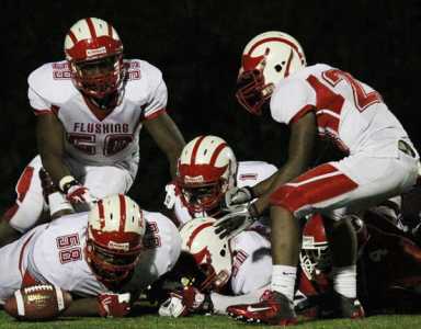 Flushing football shuts down JFK