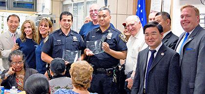 Flushing officers honored for murder suspect arrest