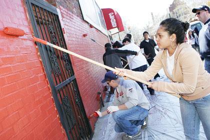 Youths clean East Elmhurst graffiti