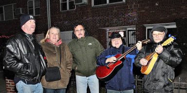 Holiday carolers serenade Jackson Heights residents