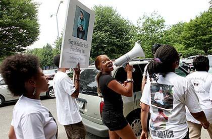 Jamaica marches in honor of slain neighbor