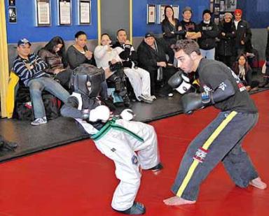 Fighter educates with fists Instructs pint-sized pugilists in punches, kicks and life lessons