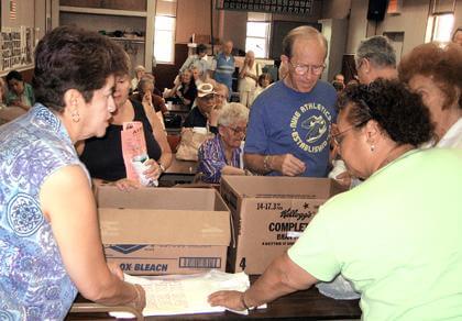 Crowley, MidVille gardeners distribute vegetables to seniors