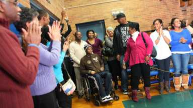Crowd cheers athlete’s return after shooting