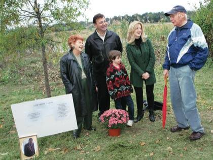 Doug residents plant tree for late area leader
