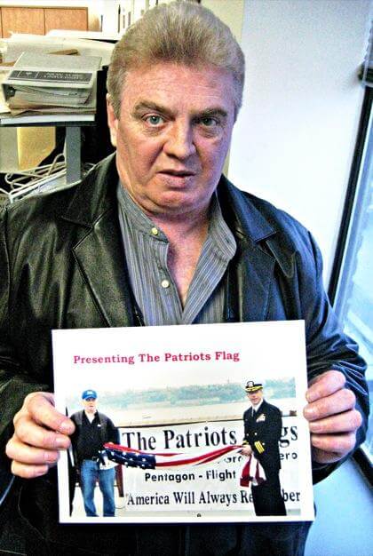 Glen Oaks Ground Zero worker presents Sept. 11 flag to ship