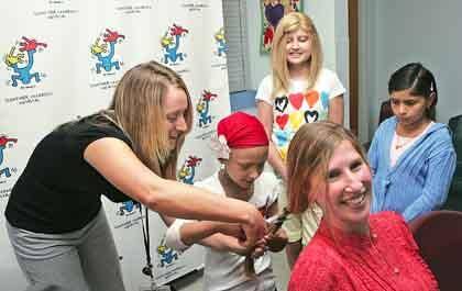 Schneider assistant donates her hair for patients