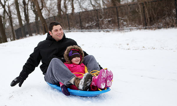 Snow-covered Francis Lewis Park perfect for sled riders