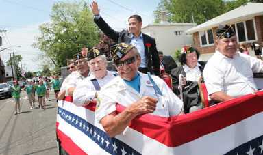 Boro groups act to save parade