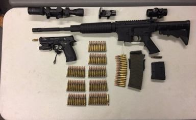 The AR-15 assault rifle and ammunition, along with other gun paraphernalia, seized from an Ozone Park home on March 13.