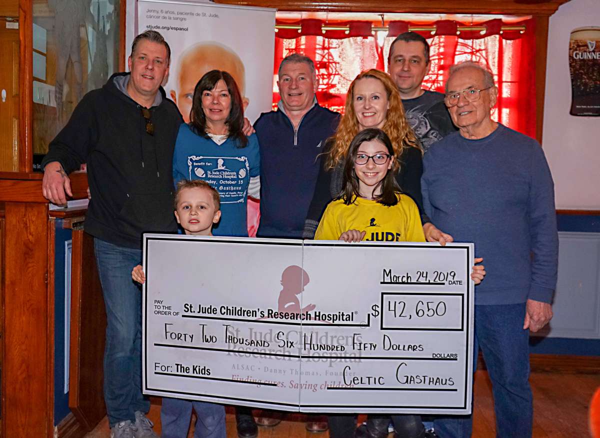Shown at the check presentation for St. Jude's Children's Research Hospital: Pete and Eleanor Kimlingen, Ollie Conneely, Michelle Redaj, Boris Redaj, Vinny DePaola and Sara and Jimmy Redaj.